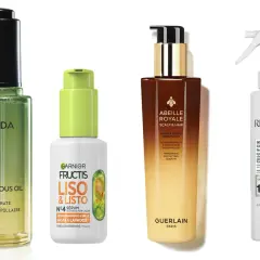 Cuatro productos para el cuidado del cabello: un aceite de Aveda, un sérum de Garnier Fructis para cabello encrespado, un tratamiento de Guerlain y un acondicionador de Redken.