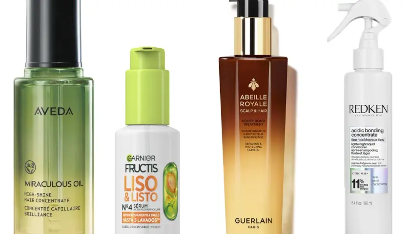 Cuatro productos para el cuidado del cabello: un aceite de Aveda, un sérum de Garnier Fructis para cabello encrespado, un tratamiento de Guerlain y un acondicionador de Redken.