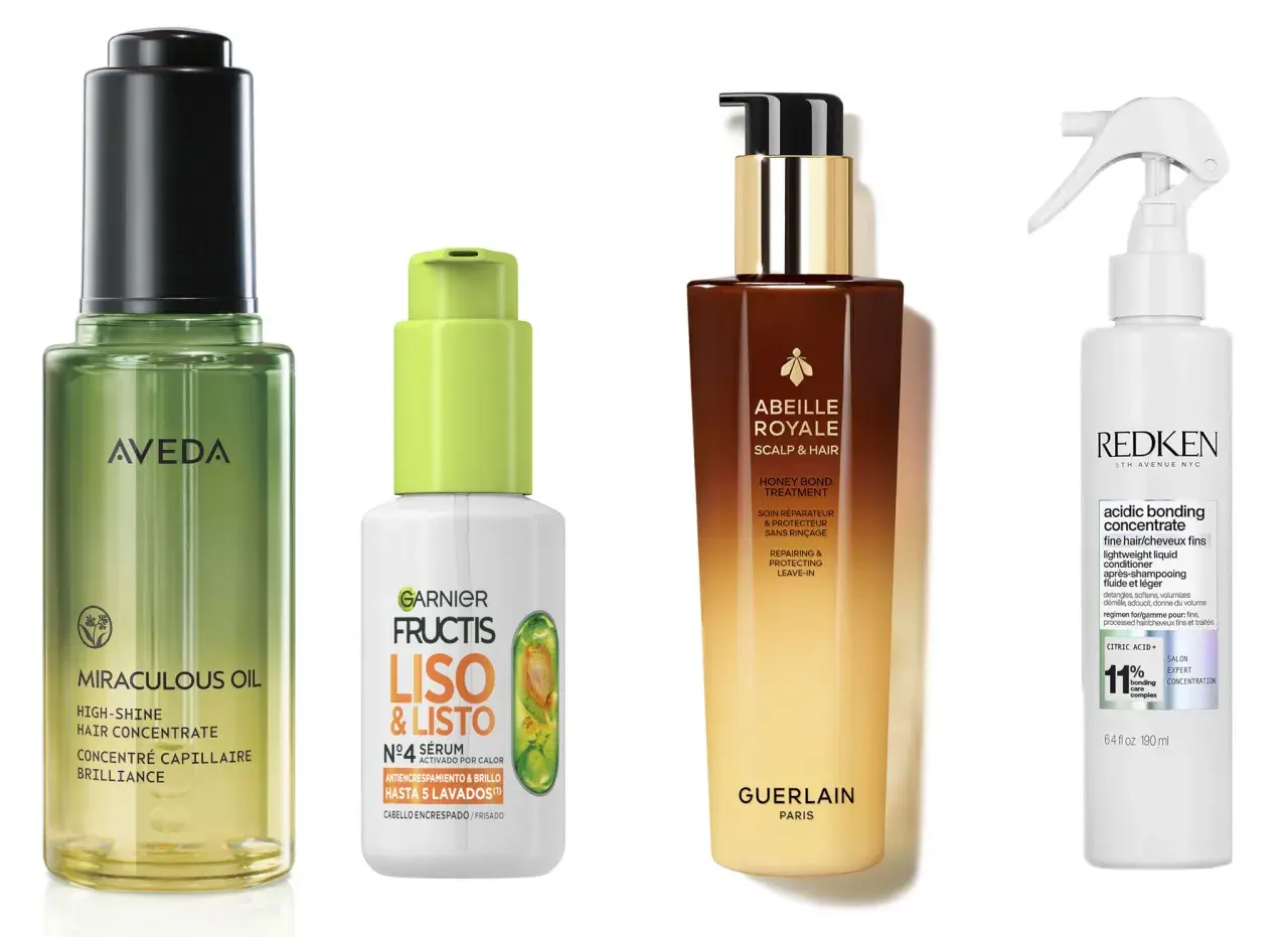 Cuatro productos para el cuidado del cabello: un aceite de Aveda, un sérum de Garnier Fructis para cabello encrespado, un tratamiento de Guerlain y un acondicionador de Redken.